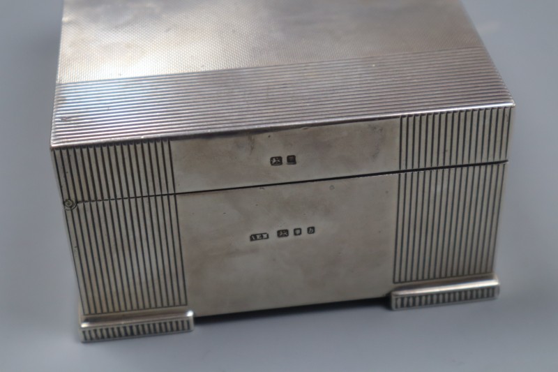 Two silver mounted cigarette boxes, including late 1950s, largest 14.1cm, gross 31 oz.